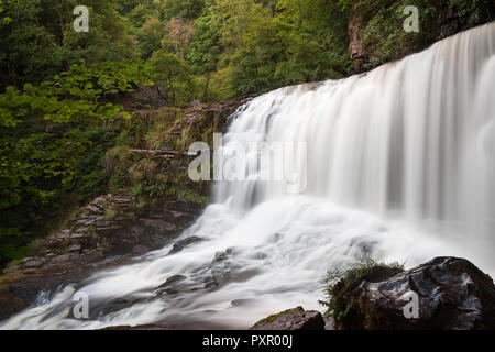 Long exposure of a waterfall in a woodland, Ystradfellte, South Wales, August 2018 Stock Photo