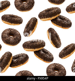 Donuts in chocolate glazed with chocolate chips isolated on the white background, seamless pattern. Top view. Flat lay. Food concept Stock Photo