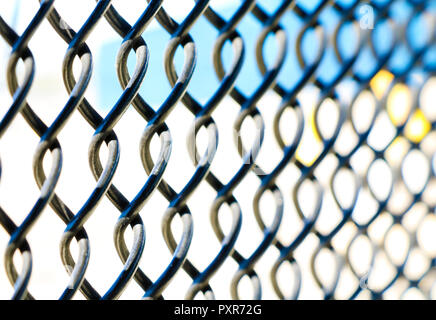 Metal fence on a white blue background Stock Photo