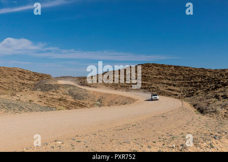 Africa, Namibia, Namib desert, Naukluft National Park, off-road vehicle on gravel road Stock Photo