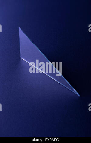 Triangle shaped mirror on dark blue ground, 3D Rendering Stock Photo