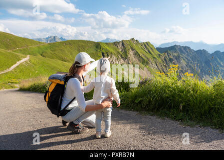 Germany, Bavaria, Oberstdorf, mother and little daughter on a hike in the mountains Stock Photo