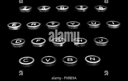 Vintage antique typewriter keys on a black background isolated Stock Photo