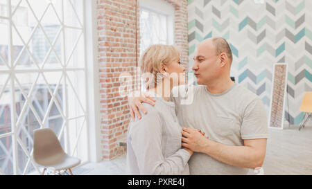 Family dinner. Family receives guests, a festive meeting. Happy Mature couple, husband and wife Stock Photo