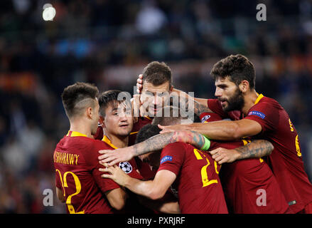 Rome, Italy, 23rd October, 2018. Roma's Edin Dzeko, third from left, celebrates with his teammates after scoring his second goal during the Champions League Group G soccer match between Roma and CSKA Moscow at the Olympic Stadium. Roma won 3-0. © Riccardo De Luca UPDATE IMAGES/ Alamy Live News Stock Photo