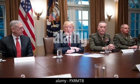 United States President Donald J. Trump makes a statement to the media as he prepares to receive a briefing from senior military leaders in the Cabinet Room of the White House in Washington, DC on Tuesday, October 23, 2018. The President took questions on the proposed space force, immigration, the caravan and Saudi actions in the killing of Jamal Khashoggi. From left to right: US Secretary of Defense James Mattis; the President; US Marine Corps General Joseph F. Dunford, Chairman of the Joint Chiefs of Staff, and US Marine Corps General Robert B. Neller, Commandant of the Marine Corps. Credi Stock Photo