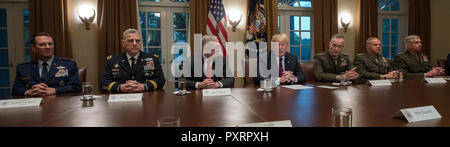 Washington DC, USA. 23rd Oct 2018. United States President Donald J. Trump makes a statement to the media as he prepares to receive a briefing from senior military leaders in the Cabinet Room of the White House in Washington, DC on Tuesday, October 23, 2018. The President took questions on the proposed space force, immigration, the caravan and Saudi actions in the killing of Jamal Khashoggi. From left to right: US Air Force General Joseph L. Lengyel, Chief of the National Guard Bureau; US Army General Mark A. Milley, Chief of Staff of the Army; US Secretary of Defense James Mattis; the Preside Stock Photo