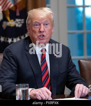 Washington DC, USA. 23rd Oct 2018. United States President Donald J. Trump makes a statement to the media as he prepares to receive a briefing from senior military leaders in the Cabinet Room of the White House in Washington, DC on Tuesday, October 23, 2018. The President took questions on the proposed space force, immigration, the caravan and Saudi actions in the killing of Jamal Khashoggi. Credit: MediaPunch Inc/Alamy Live News Stock Photo