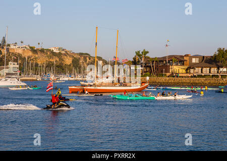 Dana Point California USA 23rd Oct 2018.  Canoes circle the Hikianalia A traditional Polynesian voyaging canoe arriving in Dana Point California  after sailing more than 2,800 miles from the shores of Hawaii across the North Pacific  carrying a message of Mālama Honua – caring for our Island Earth Credit: Duncan Selby/Alamy Live News Stock Photo