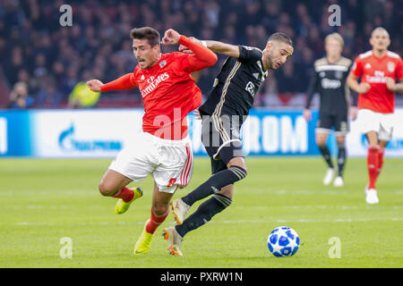 Ajax, Amsterdam. 23rd Oct 2018. 23-10-2018: Voetbal: Ajax v Benfica: Amsterdam L-R Gabriel of Benfica , Hakim Ziyech of Ajax Champions League 2018-2019 Credit: Orange Pictures/Alamy Live News Stock Photo