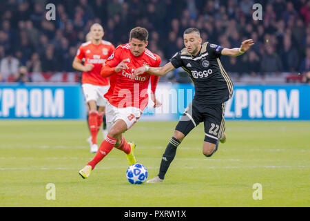 Ajax, Amsterdam. 23rd Oct 2018. 23-10-2018: Voetbal: Ajax v Benfica: Amsterdam L-R Gabriel of Benfica , Hakim Ziyech of Ajax Champions League 2018-2019 Credit: Orange Pictures/Alamy Live News Stock Photo