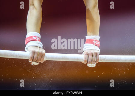 Doha, Qatar. 24th Oct, 2018. A gymnast from France practices on the uneven bars during the second day of podium training before the competition held at the Aspire Dome in Doha, Qatar. Credit: Amy Sanderson/ZUMA Wire/Alamy Live News Stock Photo