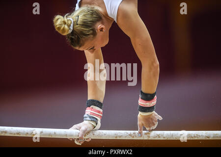 Doha, Qatar. 24th Oct, 2018. LORETTE CHARPY France practices on the uneven bars during the second day of podium training before the competition held at the Aspire Dome in Doha, Qatar. Credit: Amy Sanderson/ZUMA Wire/Alamy Live News Stock Photo