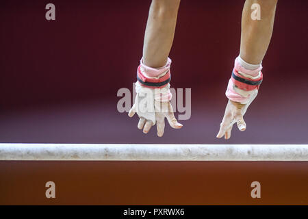 Doha, Qatar. 24th Oct, 2018. A gymnast from France practices on the uneven bars during the second day of podium training before the competition held at the Aspire Dome in Doha, Qatar. Credit: Amy Sanderson/ZUMA Wire/Alamy Live News Stock Photo