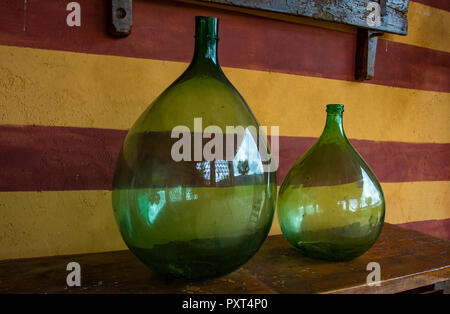 large antique glass bottle with light green liquid as medicine and herbal  mixture Stock Photo - Alamy