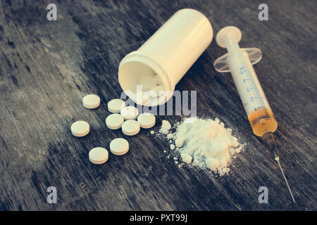 Springin Drug Syringe and heroin on wooden background with shadow edge. Drug ...