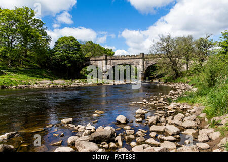 The aqueduct bridge over the river Wharf on the Bolton Abbey Estate in North Yorkshire Stock Photo