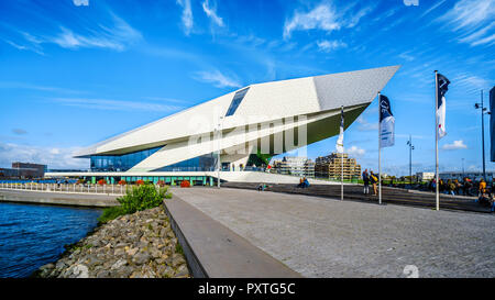 The futuristic building shape of the Eye Film Museum and the building of the Amsterdam Lookout on the North shore of the harbor named Het IJ, Holland Stock Photo
