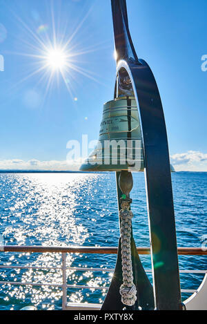 Steam boat Hohentwiel, golden handbell, Lake Constance against the sun Stock Photo
