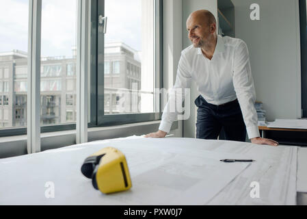 Engineer working in his office, with VR glasses on his desk Stock Photo