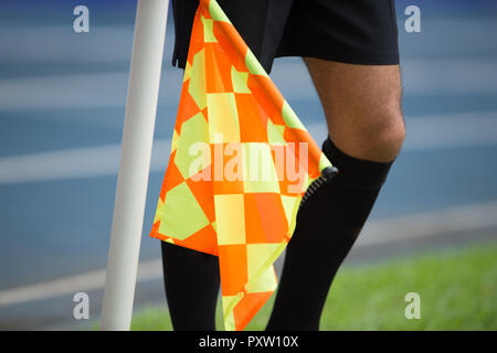 Assistant referee hold flag Stock Photo