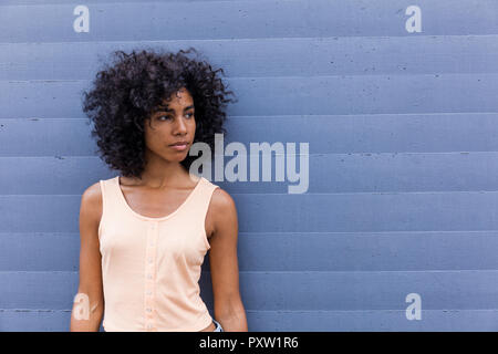 Portrait of young woman with curly black hair Stock Photo