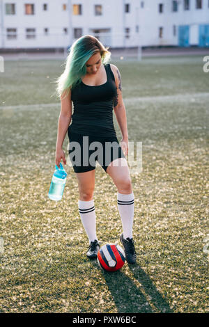 attractive young women in 80s style sportswear standing together