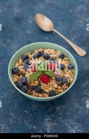 Bowl of muesli with raspberries and blueberries Stock Photo