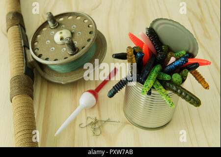 Close-up, detail, can, colourful artificial worms, fishing equipment, catch fish, rod, reel Stock Photo