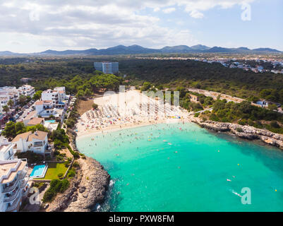 Spain, Mallorca, Portocolom, Aerial view of Punta des Jonc, Bay of Cala Marcal, beach with tourists Stock Photo