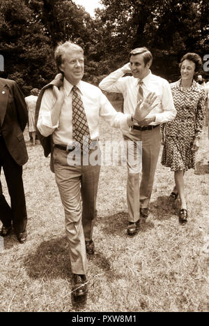 Jimmy Carter leaving church picnic with Mondales. - To license this image, click on the shopping cart below Stock Photo