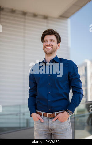 Portrait of smiling businessman in the city Stock Photo