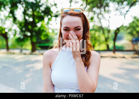 Portrait of laughing redheaded woman Stock Photo