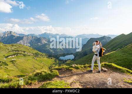 Germany, Bavaria, Oberstdorf, mother and little daughter on a hike in the mountains Stock Photo
