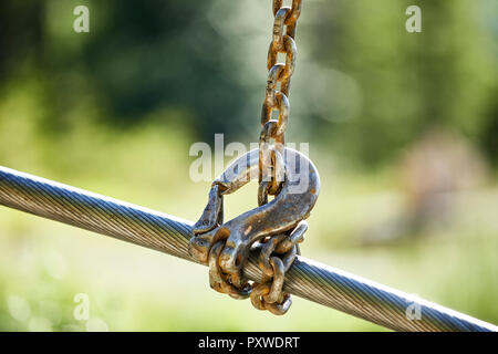 Crane hook lifting up steel rope Stock Photo