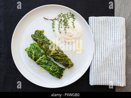 Two savoy cabbage rolls on plate Stock Photo