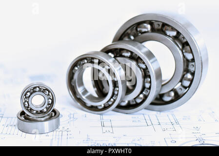 Quality control in modern mechanical engineering - technical drawing and ball bearings on white background Stock Photo