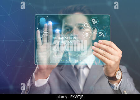 The concept of business, technology, the Internet and the network. A young entrepreneur working on a virtual screen of the future and sees the inscrip Stock Photo