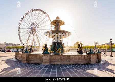 France, Paris, Place de la Concorde, fountain and Roue de Paris, big wheel Stock Photo