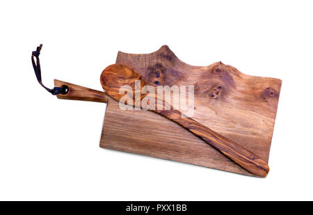 Cutting the old wooden board with a wooden spoon. Stock Photo
