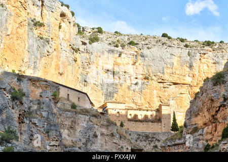 The Our Lady of Jaraba Sanctuary in the Barranco de la Hoz Seca canyon (Dry Defile Gully) in the Aragon region, Spain, during a sunny summer day Stock Photo