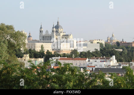 The Almudena Cathedral (Catedral de la Almudena) as seen from the West Gardens (Parque del Oeste) during a summer sunset, Madrid, Spain Stock Photo