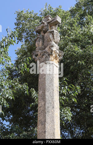 A stone made cross Calvary at the entrance of  Santa Maria Collegiate church and castle during a sunny day in Aragon region, Spain. Stock Photo