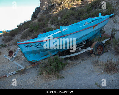 A fisherman's boat pulled up the hill from the sea on the Greek island of Kos Stock Photo