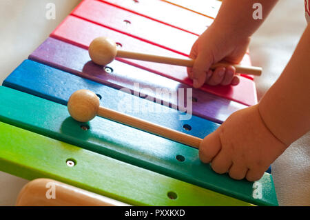 Baby Plays Colorful Toy Xylophone Stock Photo