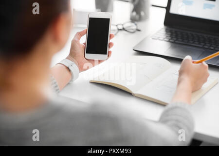 web designer working on smartphone user interface Stock Photo