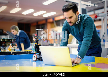 Young student of mechatronics working on project Stock Photo