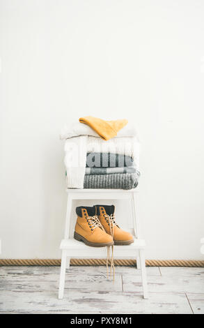 Warm clothing, blankets, boots and cap for cold weather Stock Photo