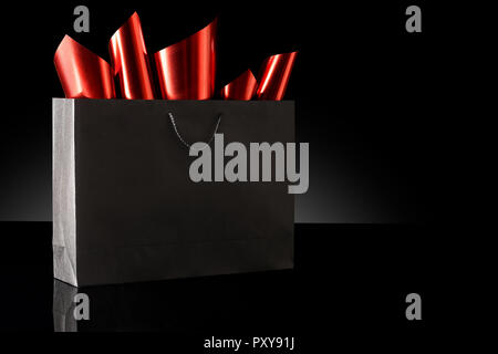 Shopping bag against a black background Stock Photo