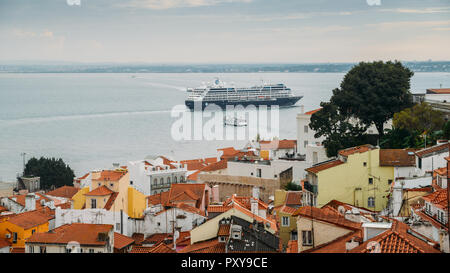 Lisbon, Portugal - Oct 24, 2018: Cruise ship sailing on Tagus River in Lisbon at dusk Portugal Stock Photo